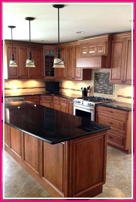 dark oak kitchen cabinets with stainless steel countertop|marble countertops with oak cabinets.